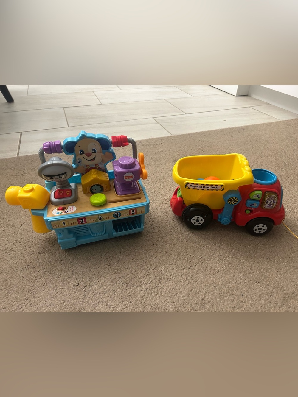 Bundle of 2 Toys - Laugh & Learn Tool Bench and Drop & Go Dump Trunk